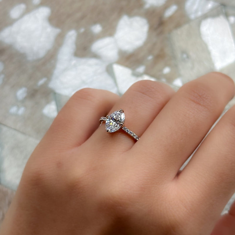 Delicate halo engagement ring