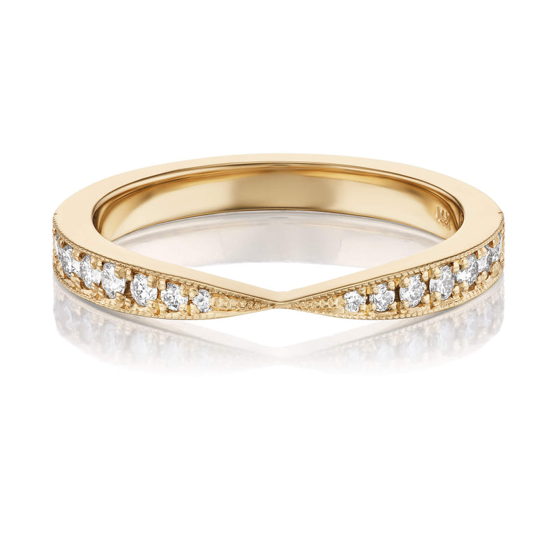 A gold band ring with a pinched design featuring diamonds along the top edge, shown against a white background.