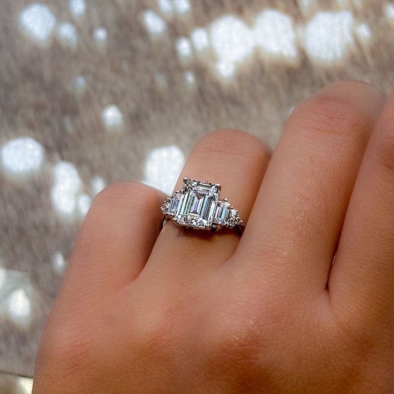 2.5 CT emerald cut and trapezoid engagement ring