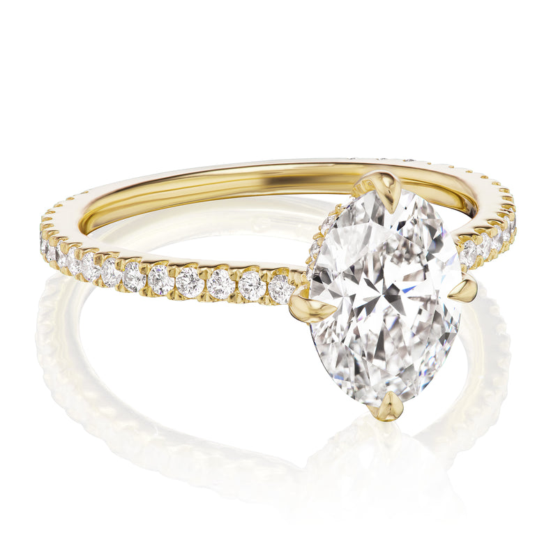 Oval diamond halo ring yellow gold